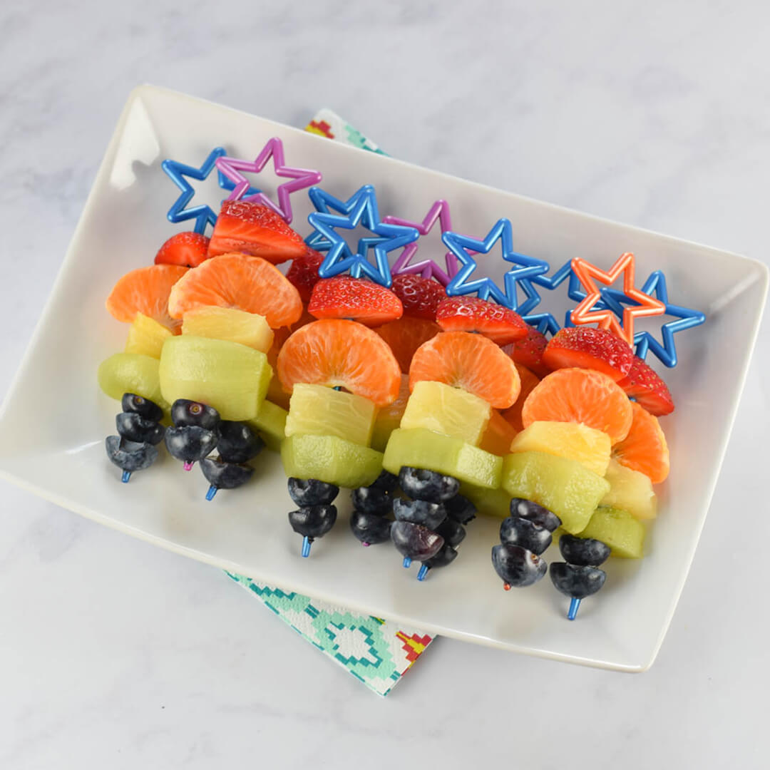Rainbow Fruit Kebabs on a platter