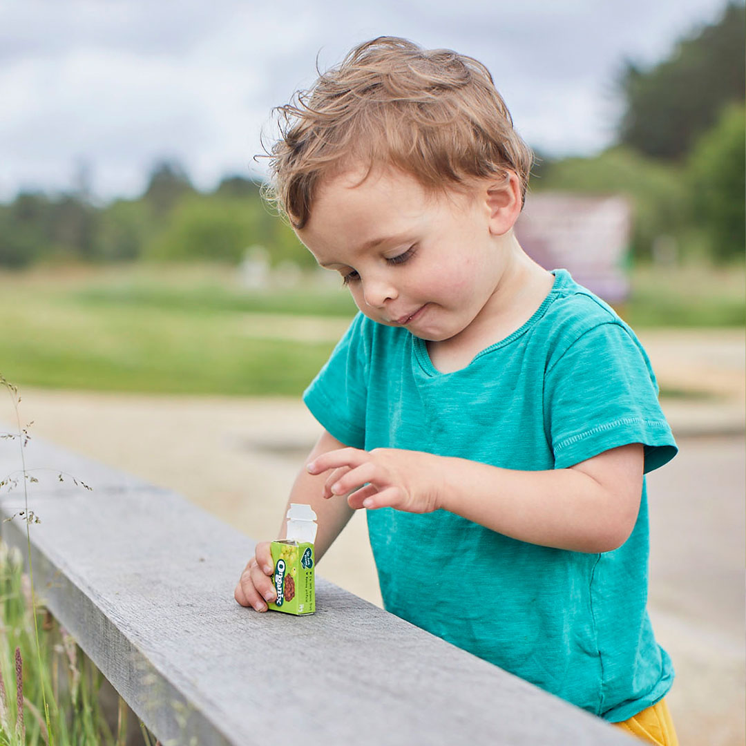 Young child with box of raisins 