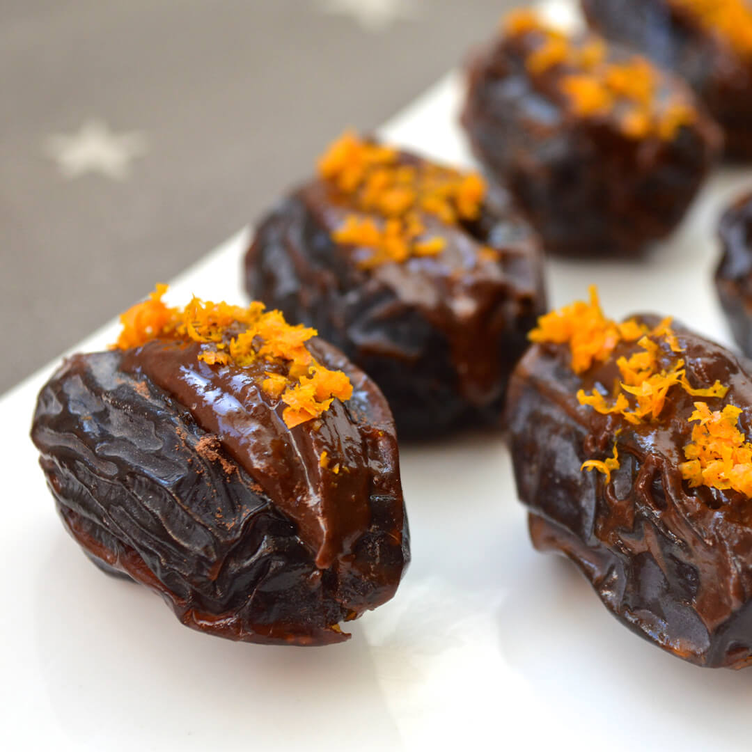 Choc Orange Dates: dates stuffed with a chocolate nut/seed butter mix and topped with orange zest