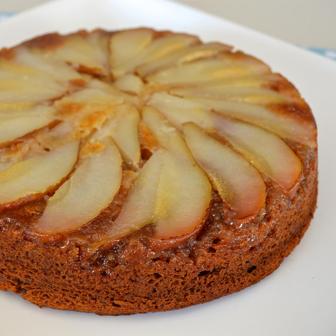 Pear Upside down Cake on a cake stand