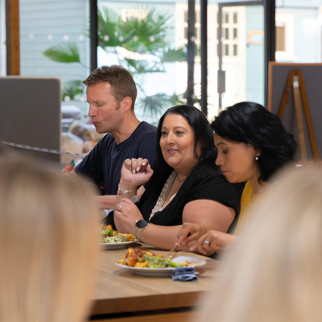 three people eating lunch