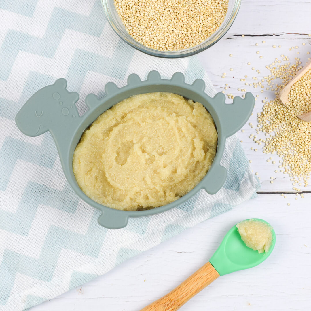 A serving of cooked quinoa next to a bowl of raw quinoa 