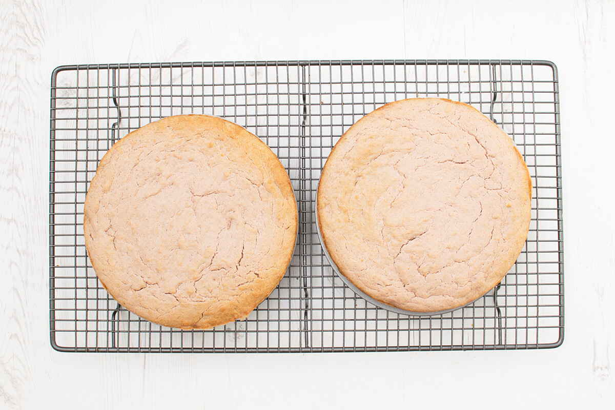 Two cakes on metal rack