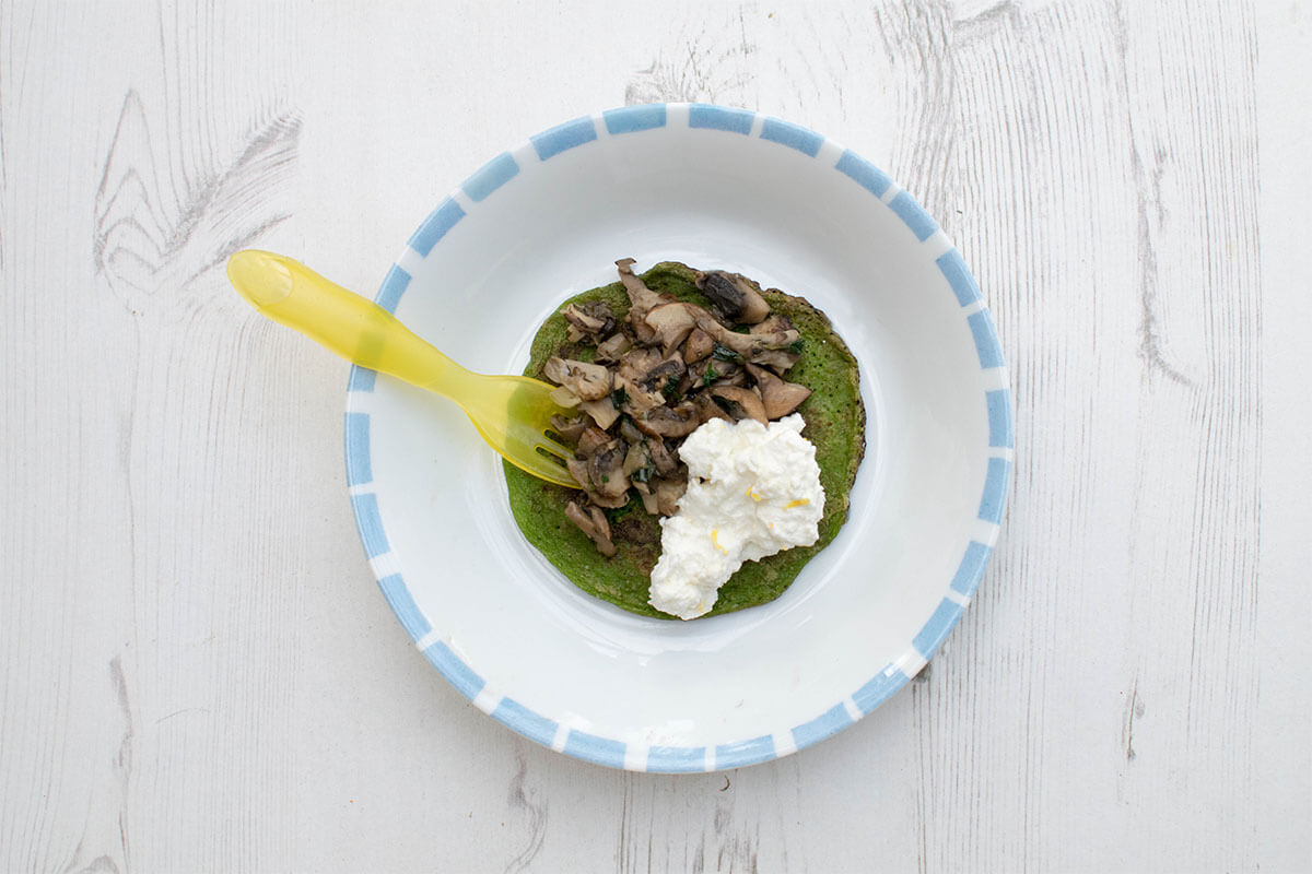 Spinach and mushroom pancakes served with ricotta and lemon