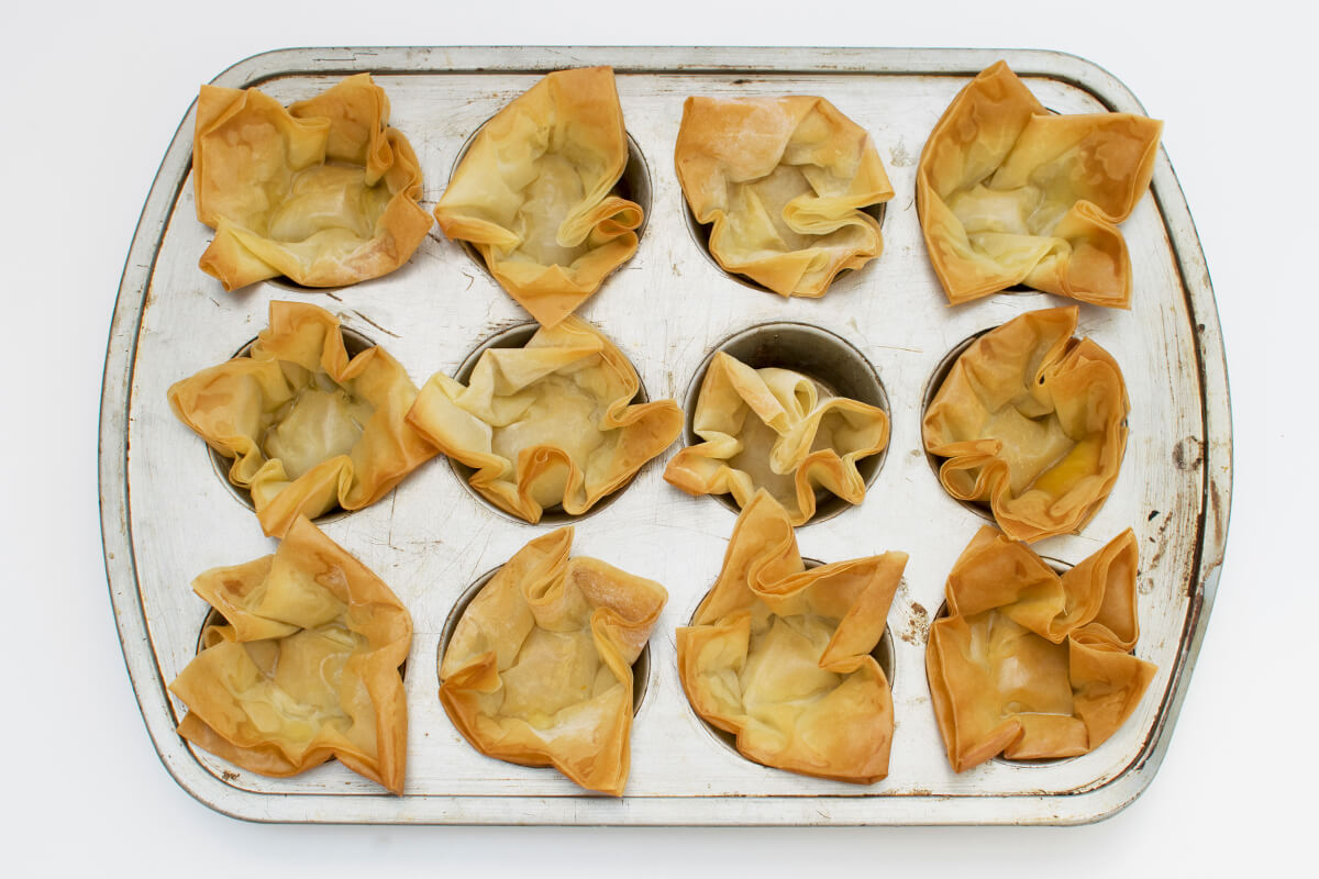 A cake tin with baked filo pastry