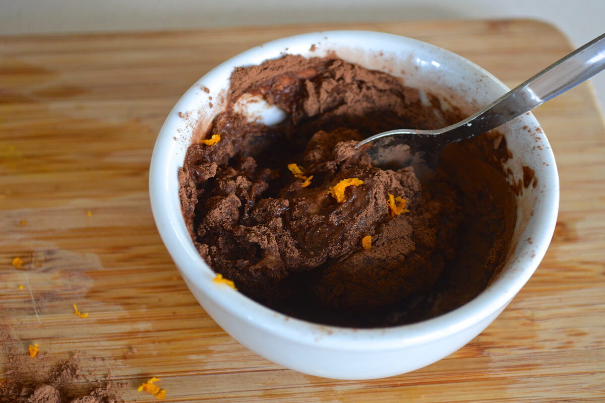 A bowl of nut/seed butter with cocoa powder, orange zest and juice
