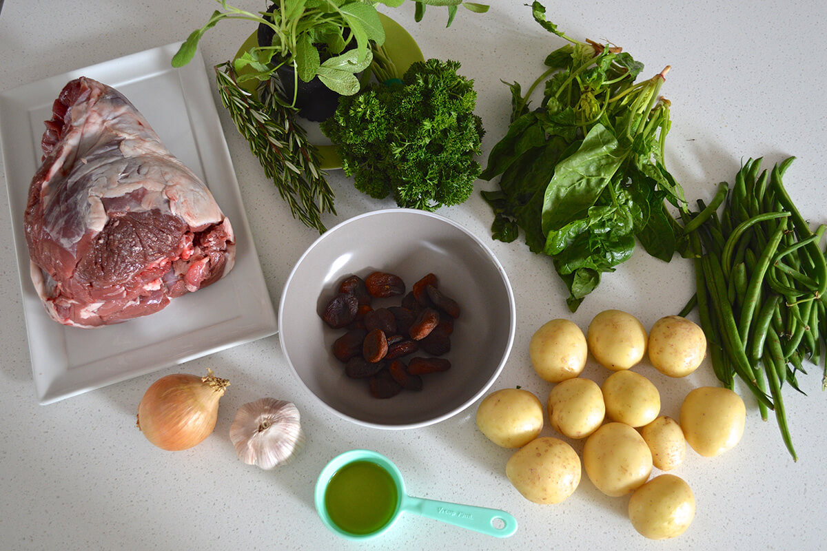 Apricot Stuffed Easter Lamb ingredients: lamb, onion, garlic, olive oil, potatoes, apricots, rosemary, sage and parsley