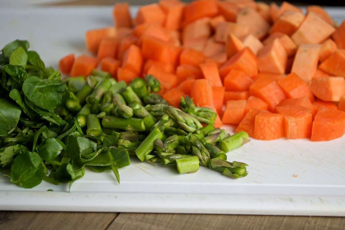 Diced sweet potato and carrots with chopped asparagus, watercress and chives