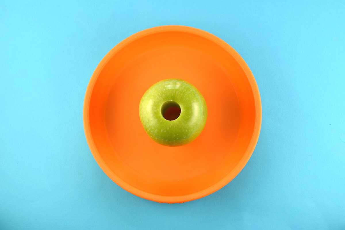 Cored apple placed on plate