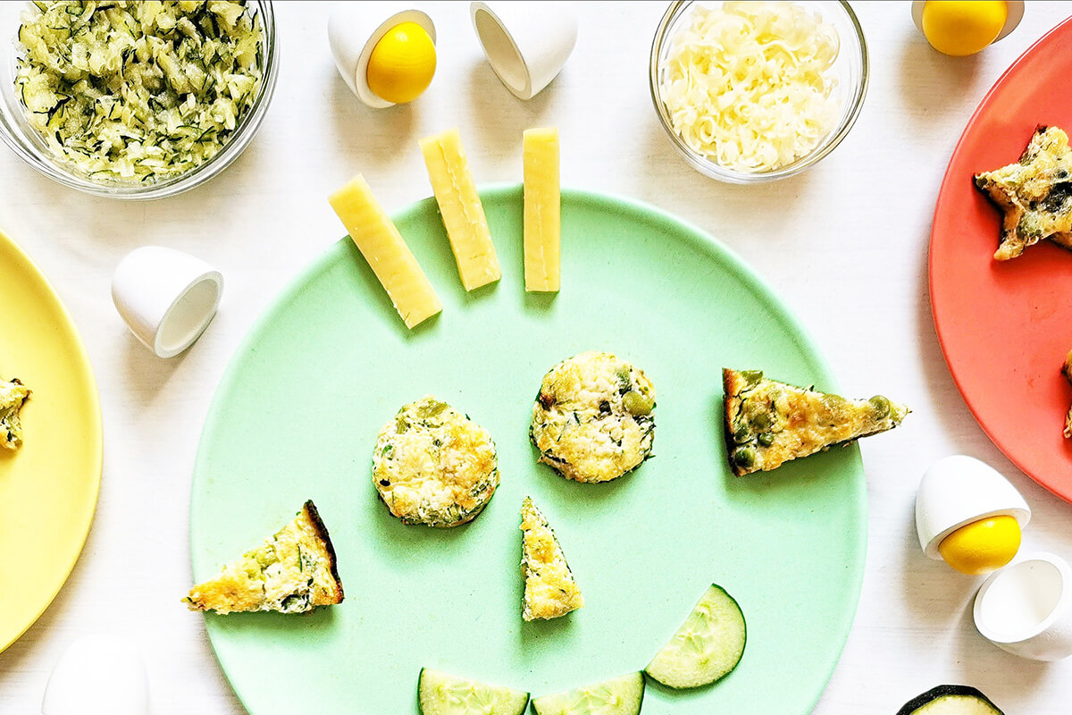 Courgette, Pea & Bean Frittata served with cucumber slices and cheese sticks