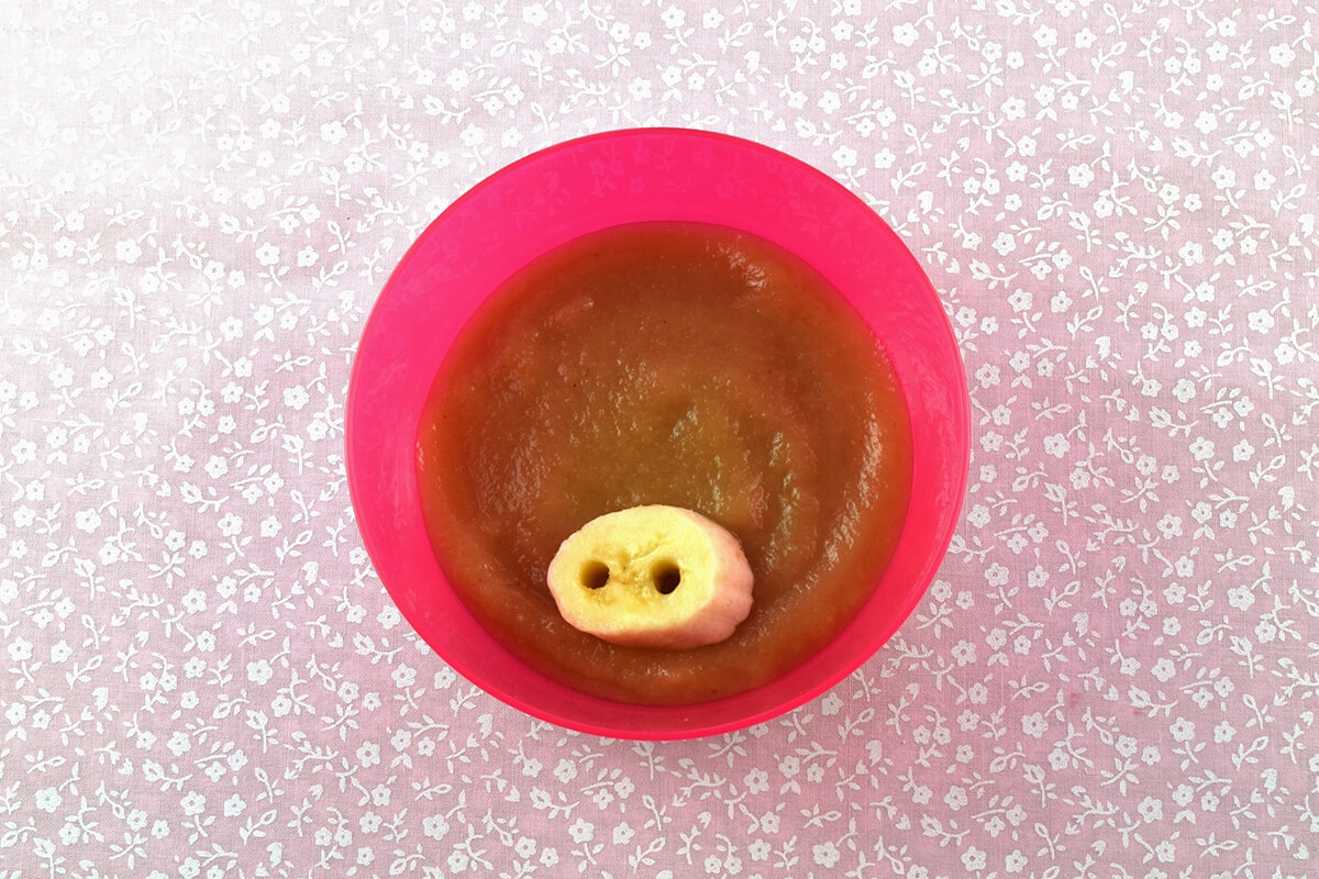 Fruit puree with banana cut into snout shape on top