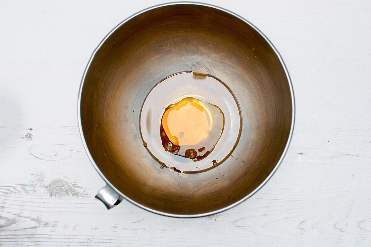 A bowl with oil, eggs, honey and vanilla