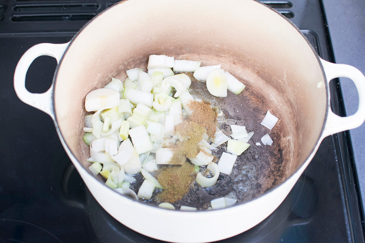 A saucepan with diced leeks and onion