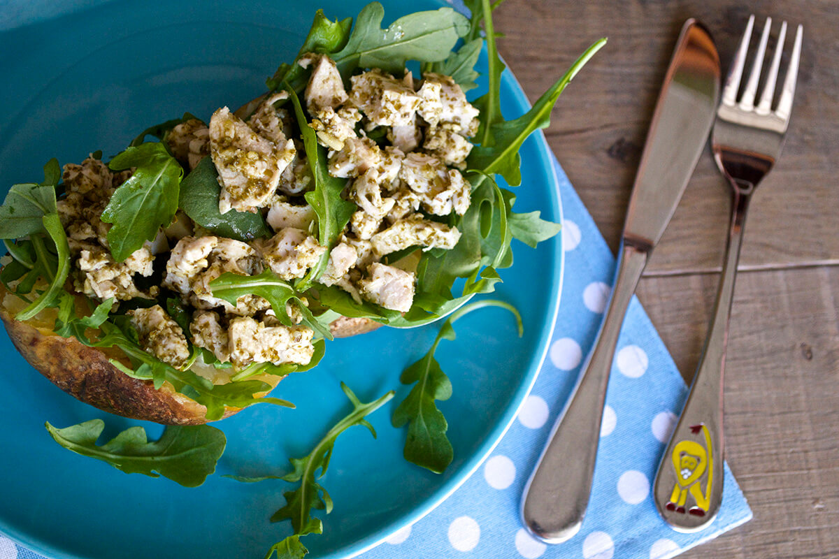 Jacket Potato With Pesto & Chicken served with a mixed leaf salad