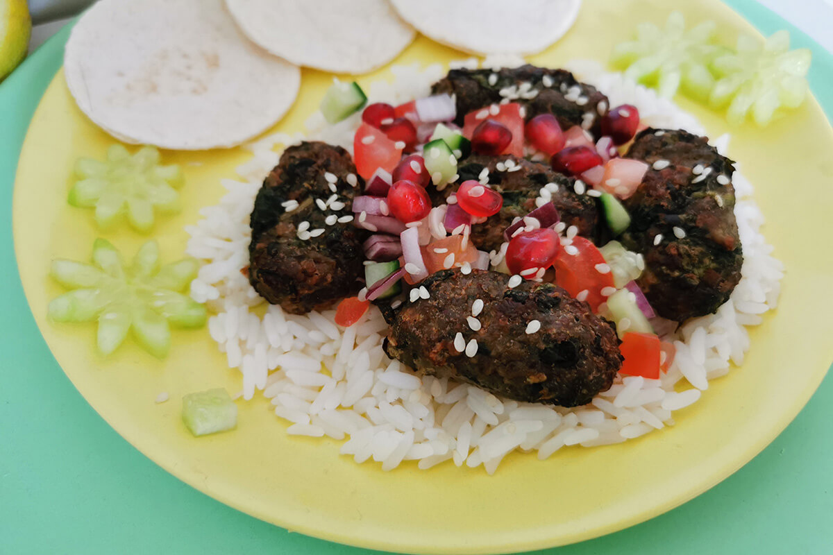 Lamb koftas served with rice and pomegranate salad