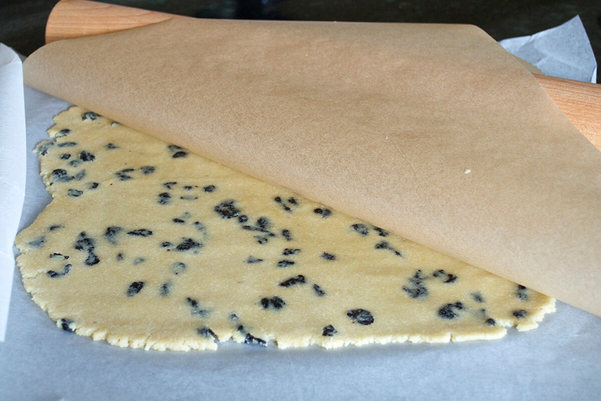 Loveheart Biscuits between two sheets of parchment paper