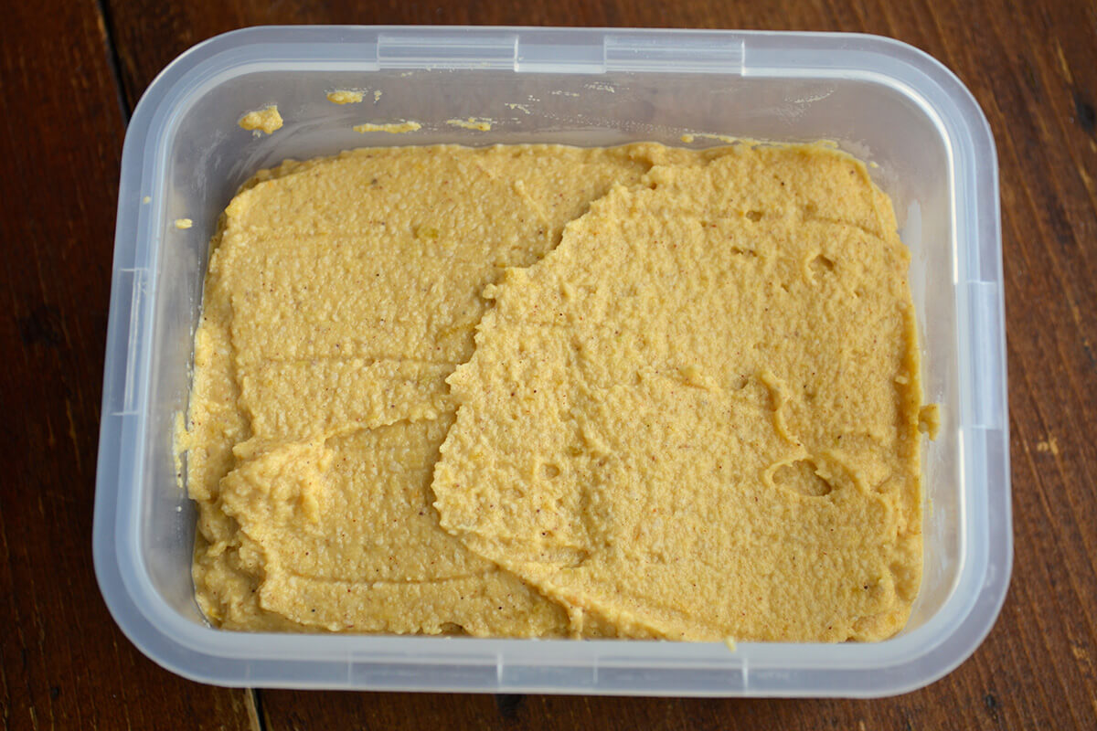 Pumpkin pie biscuit filling in a plastic tub