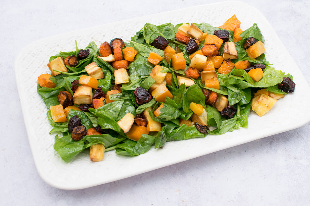 Roasted Vegetable Spinach Salad on a serving dish