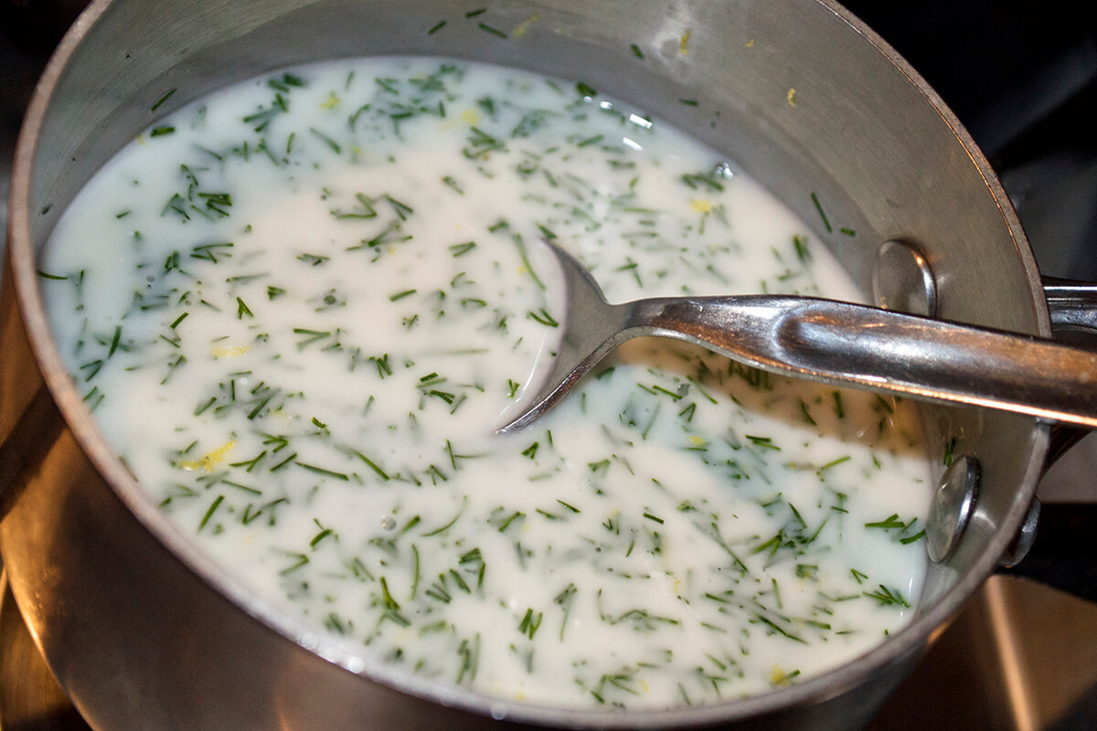 Creamy dill sauce in a saucepan