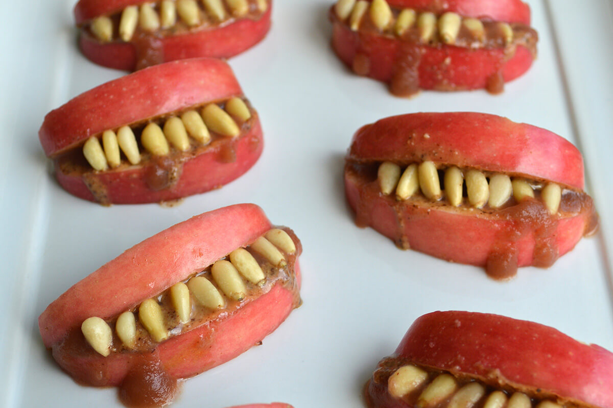 Scary Apple Teeth made with apple slices to create the lips/mouth and pine nuts/sunflower seeds to make teeth