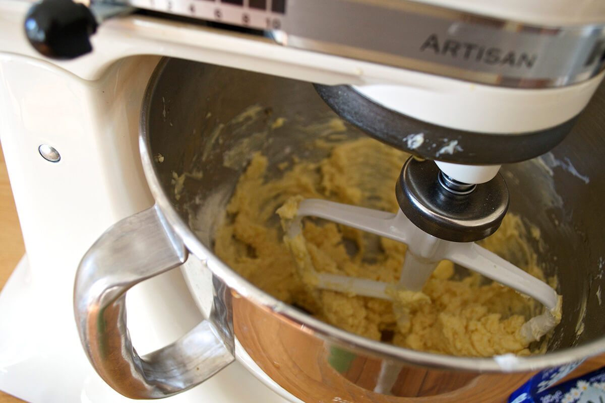 Cake batter being mixed with an electric mixer