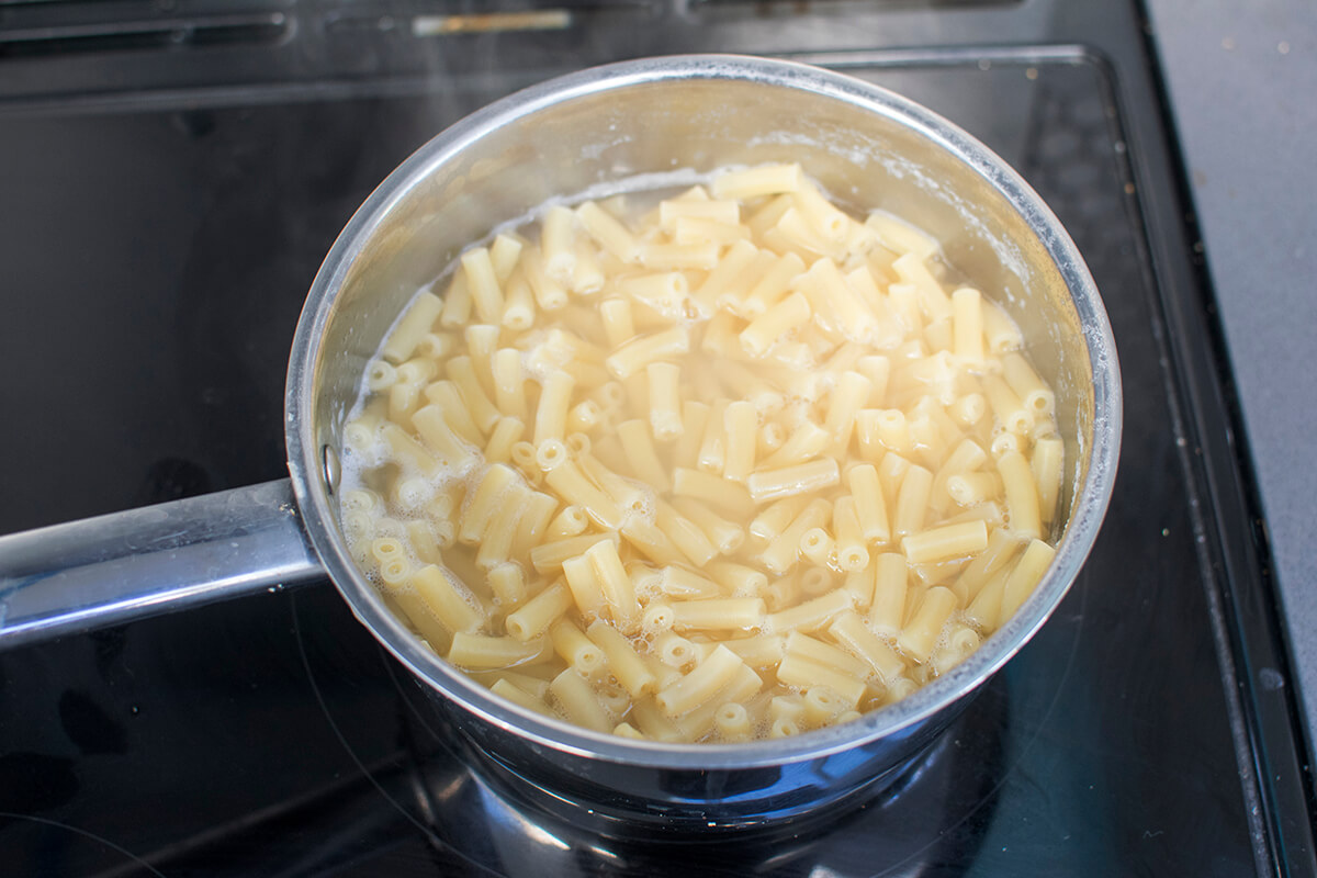 Macaroni pasta being cooked in water